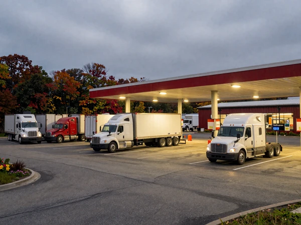 Truck stop parking lot in Pennsylvania at dusk, a common meeting point for trucker dating connections