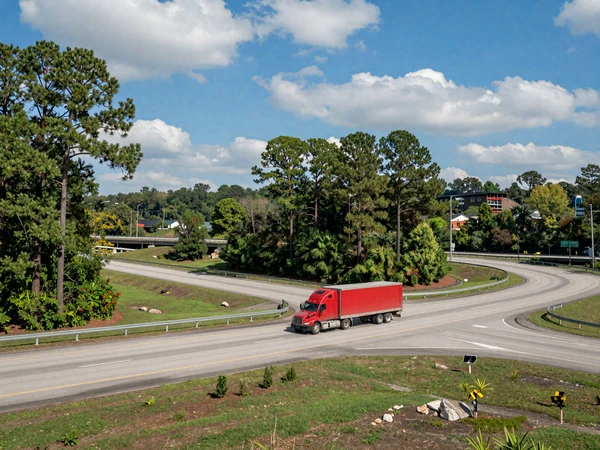 Houston I-45 highway interchange with a semi truck under a blue Texas sky